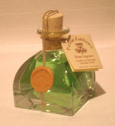 A bottle of green perfume