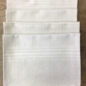 Four white placemats