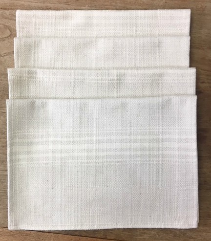 Four white placemats