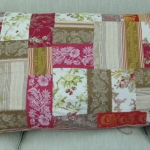 A red pillow case with floral designs