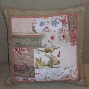 A square pastel pillow with floral designs