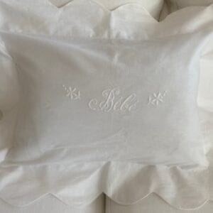 A white pillow case design with two flowers