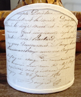 A lamp shade with sentences written across it