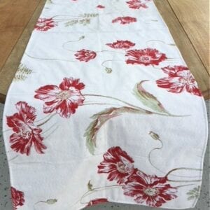 A cloth with red floral designs on a table