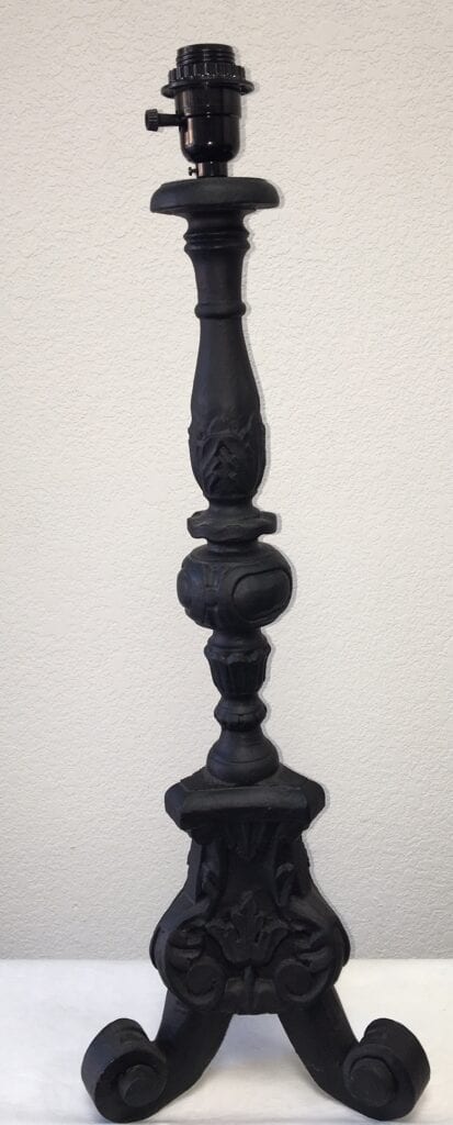 A black lamp base sconce