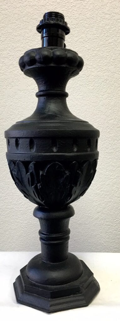 An empty black lamp base sconce