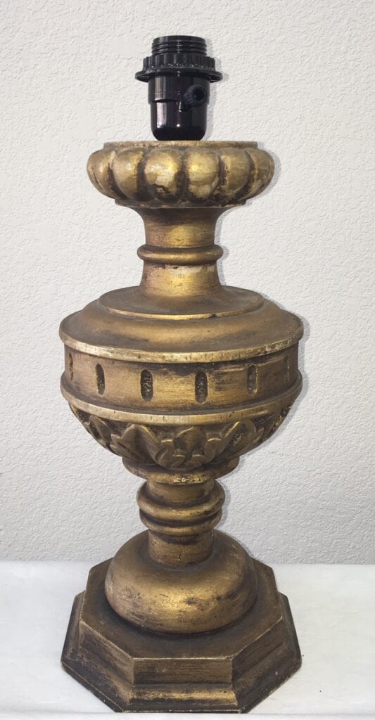 A gold lamp base sconce