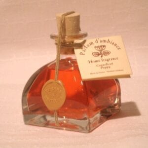A bottle of orange perfume