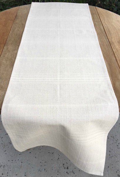 A white cloth with pale patterns