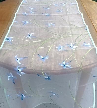 A grey cloth with blue flowers
