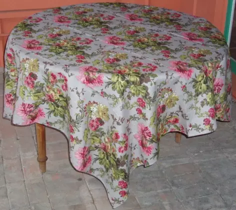 A grey linen table cloth with pink flowers