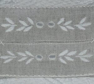 A piece of white cloth with embroidery patterns