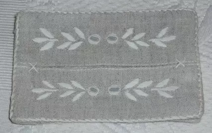 A piece of white cloth with embroidery patterns