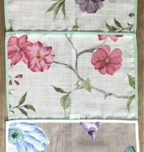 Three placemats with floral designs