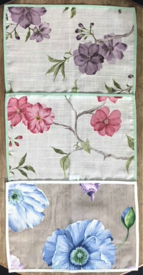 Three placemats with floral designs