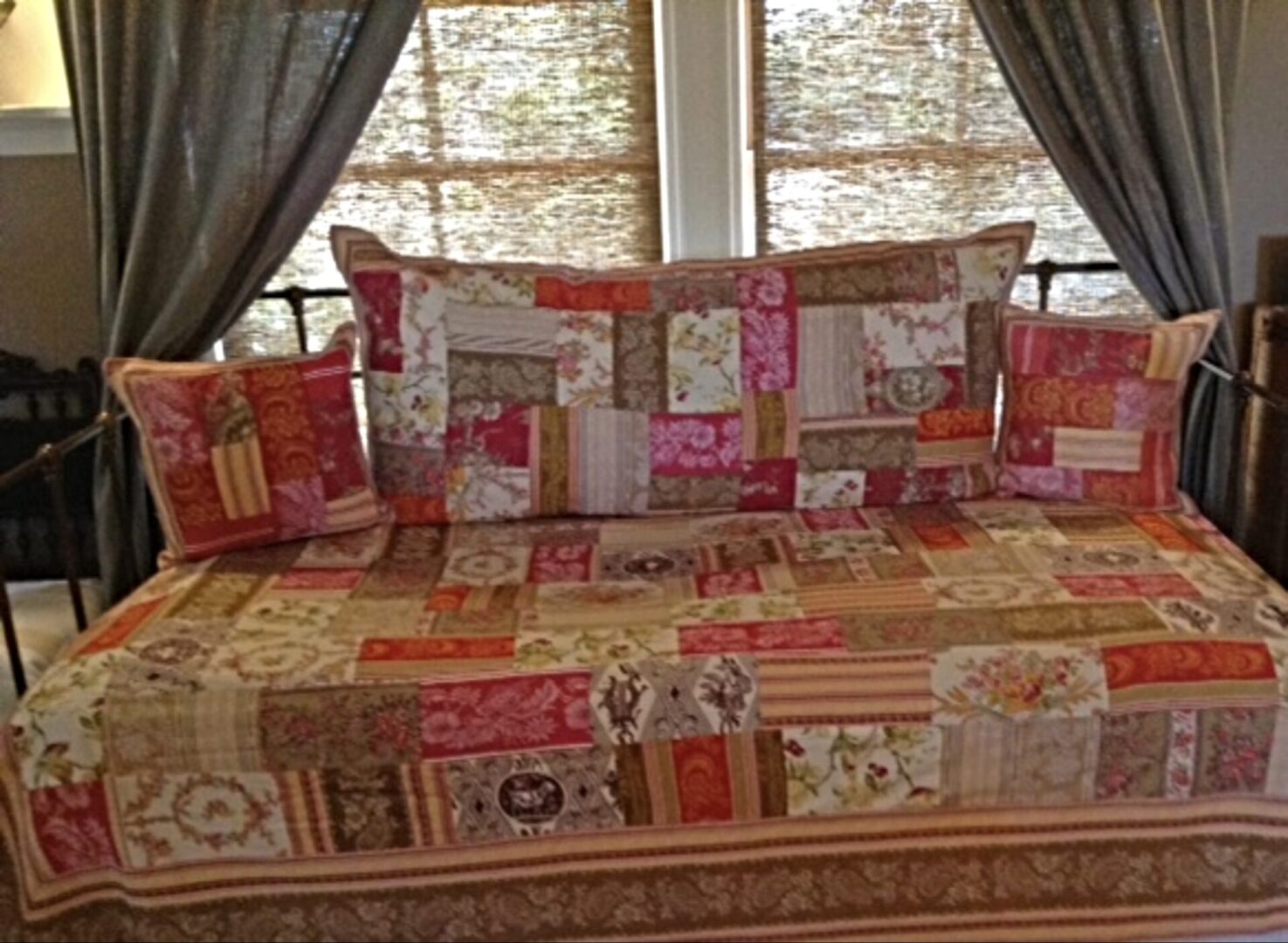 A bed with red, white, and brown patches