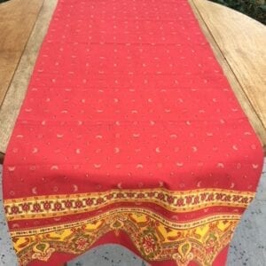 A red cloth with small butterfly patterns