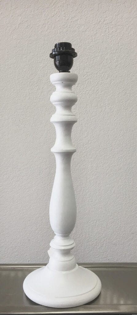 A slender lamp base sconce