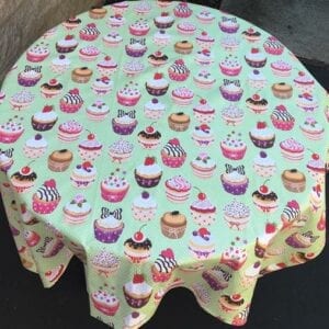 A table cloth with cupcake patterns from a top view