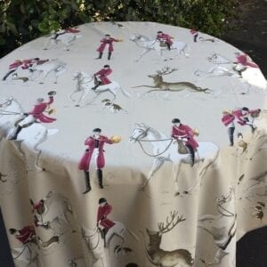 A table cloth with equestrian and stag patterns