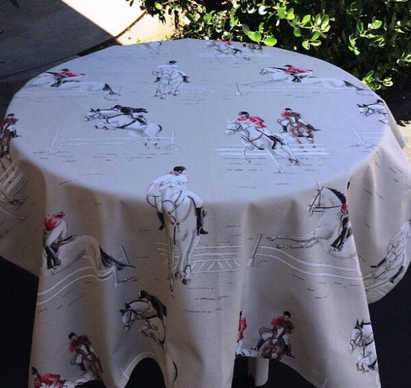 A table cloth with equestrian patterns