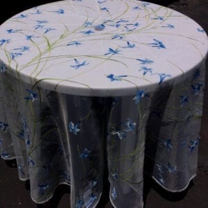 A white table cloth with blue flowers