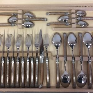 A full set of table utensils in a box