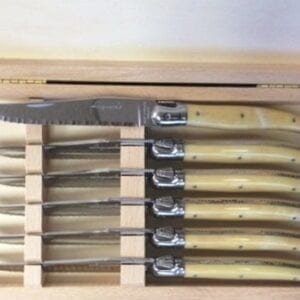 Knives with cream handles in a box