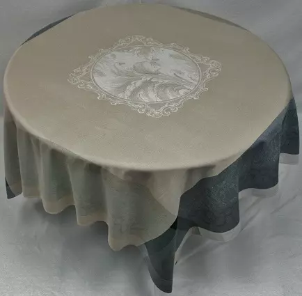 A table cloth with a white and cream center