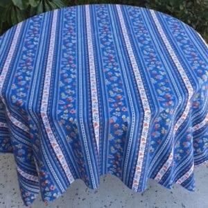 A blue table cloth with patterns and white stripes