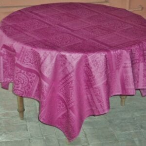 A dark pink table cloth with patterns