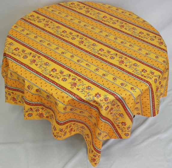 An orange and yellow table cloth with patterns