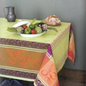A light green and purple designed table cloth