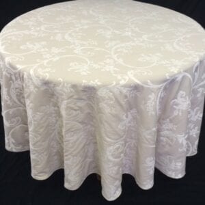 A white table cloth with bright patterns