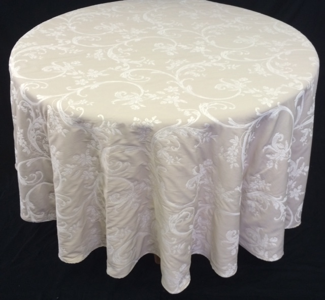 A white table cloth with bright patterns