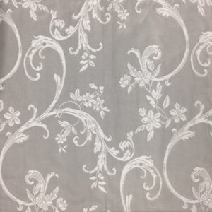 An inverted grey napkin with white floral designs