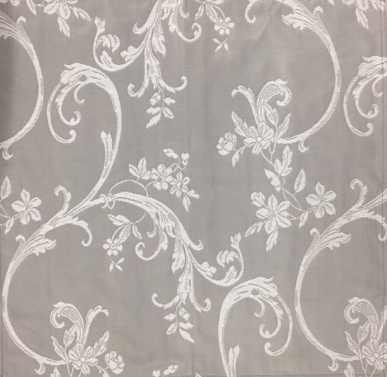 An inverted grey napkin with white floral designs