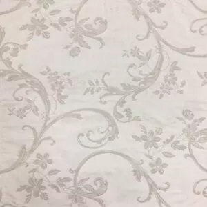 Grey floral designs on a white napkin