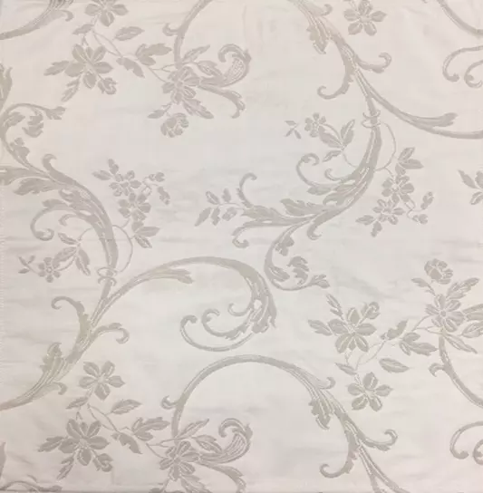 Grey floral designs on a white napkin