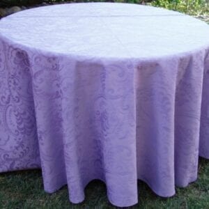 A light purple table cloth with patterns