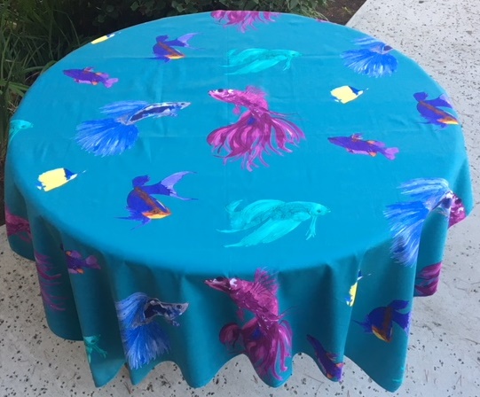 A blue table cloth with fish designs