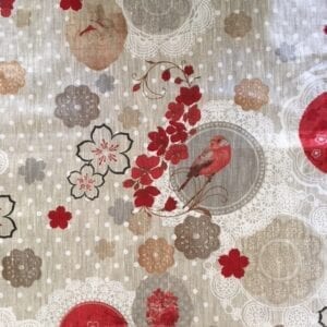 A linen table cloth with circles and floral designs