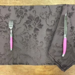 Grey placemat with pink utensils