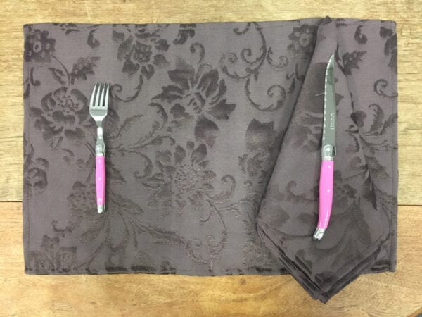 Grey placemat with pink utensils