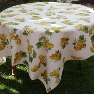A white cloth with yellow grapes patterns