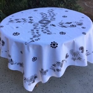 A white table cloth with black patterns