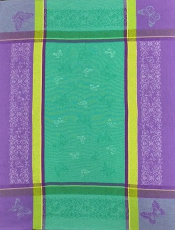 A teal tea towel with blue and yellow green butterfly patterns
