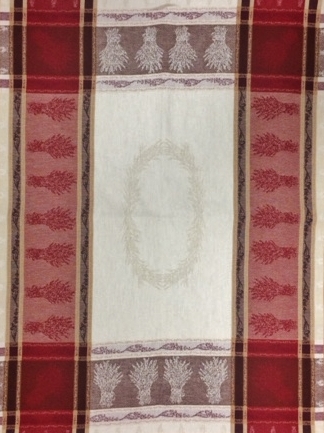 A white and red tea towel with varying patterns