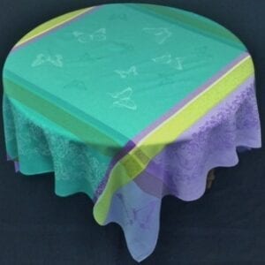 A teal and purple colored table cloth