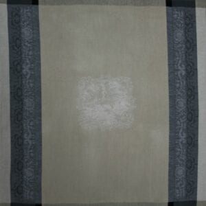 A grey tea towel with black patterns